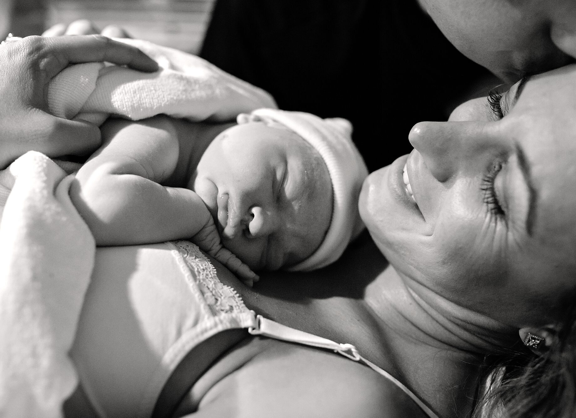 newborn baby resting on its mother's chest after being born