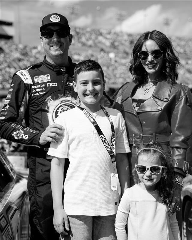 Kyle and Samantha Busch with their son and daughter at at NASCAR race